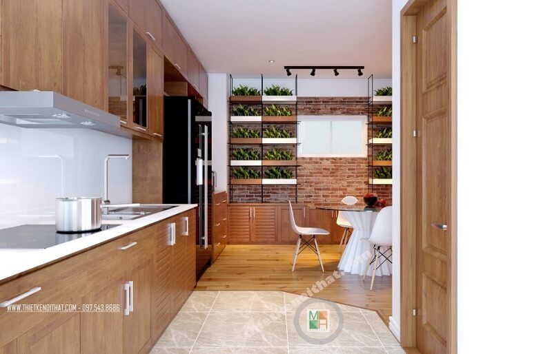 Hệ thống tủ bếp gỗ thiết kế đơn giản, hiện đại kéo dài tạo độ thoáng cho không gian và vô cùng tiện dụng.